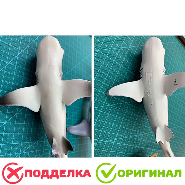 Две фигурки акулы брюхом вверх: слева подделка с гладким брюхом, справа оригинал Safari Ltd с отлитыми надписями, знаком CE и номером партии на плавнике
